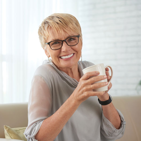 woman smiling with drinking coffee